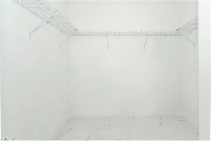 Spacious closet with marble finish flooring