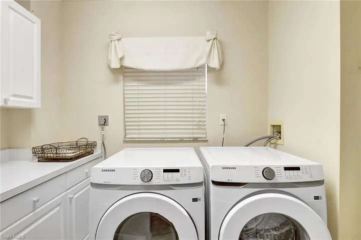Laundry area with washing machine and dryer and cabinet space