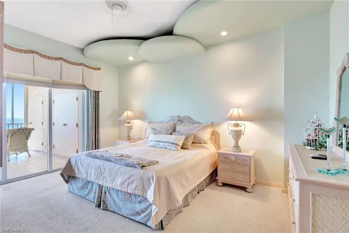 Bedroom featuring baseboards, visible vents, access to outside, and light carpet