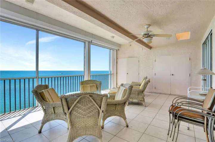 Sunroom with a water view