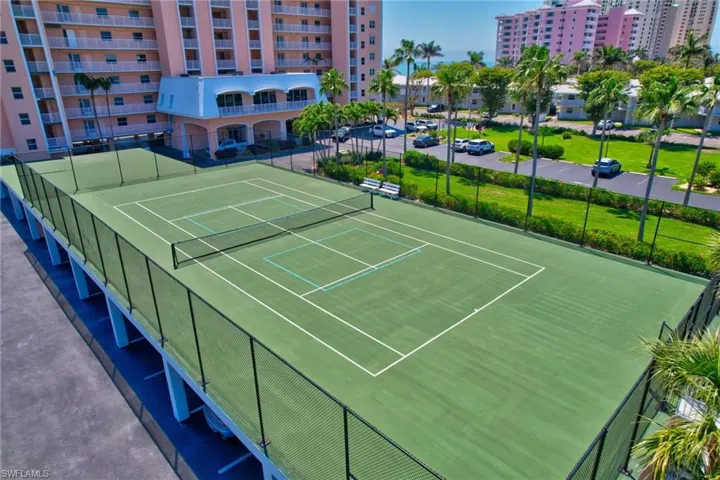 View of tennis court with fence