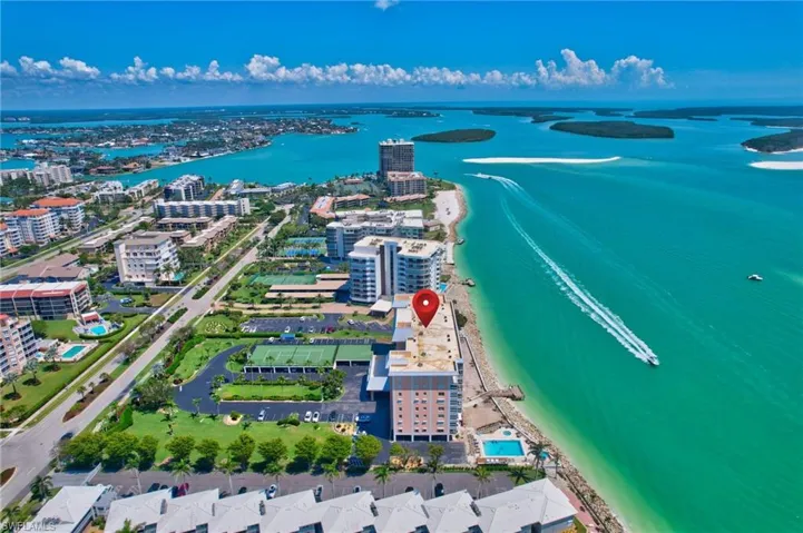 Bird's eye view with a water view, a beach view, and a city view