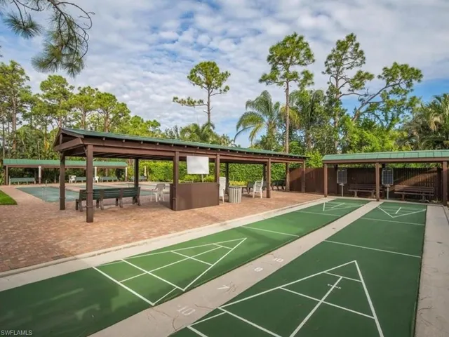 Outdoor shuffleboard courts with multiple covered seating areas