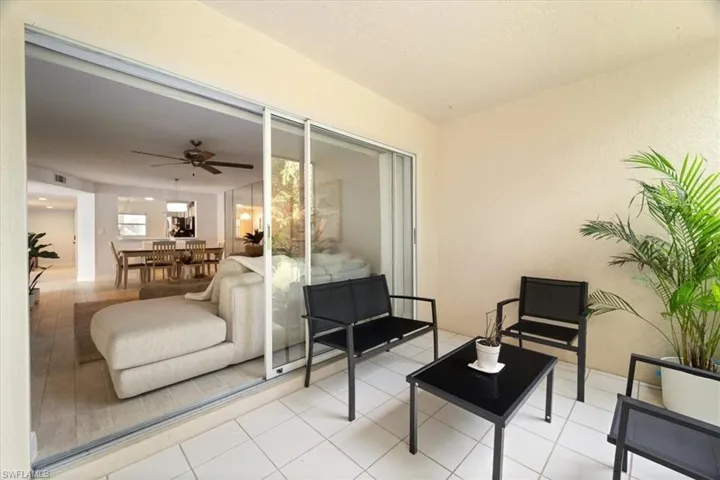View of patio featuring a ceiling fan and outdoor lounge area
