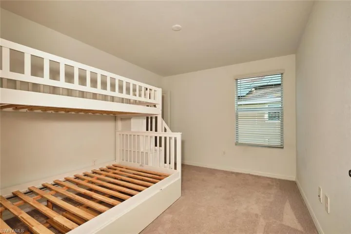 Staircase with carpet flooring and baseboards
