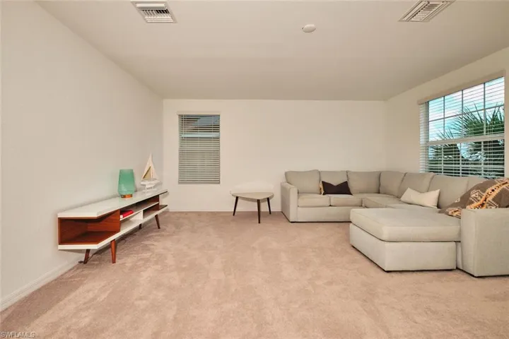 Carpeted loft/flex space w lightingith recessed