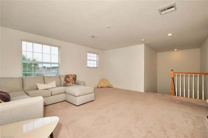 Carpeted loft/flex space w lightingith recessed