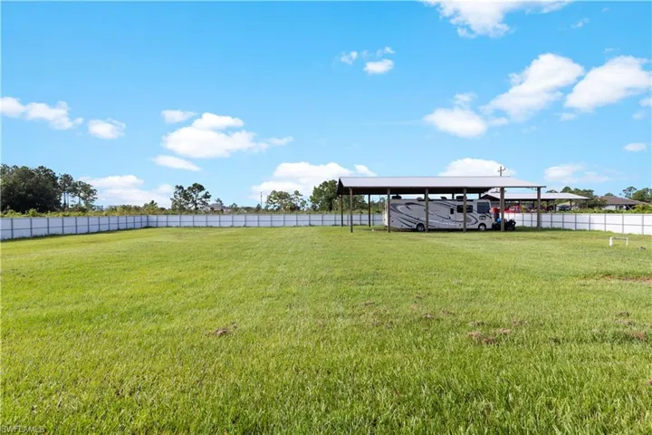 Completely Fenced-in back yard with Pole Barn
