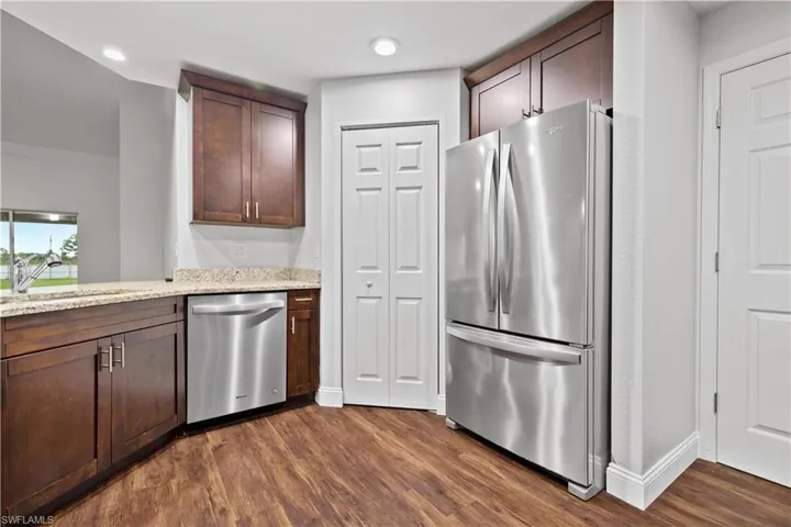 Kitchen Area showing access to walk-in Panty.