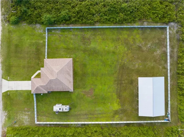 Direct overhead Aerial View of Home, Aluminum 6ft Privacy Fencing, and Pole Barn