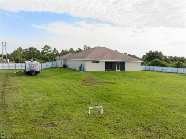 Rear of Home with Large Completely Fenced-in Private Back Yard