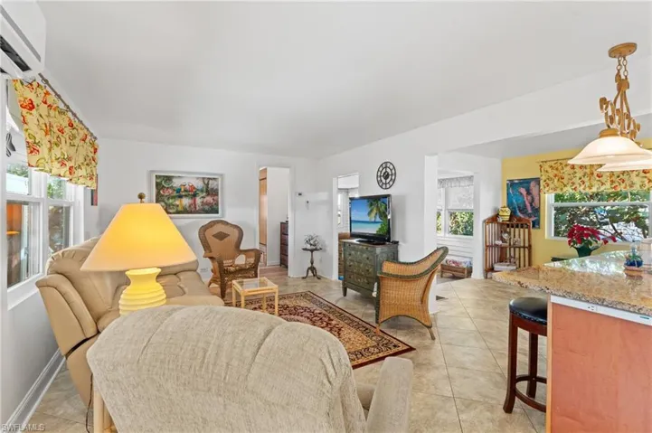 Living room view from entrance, with a wealth of natural light