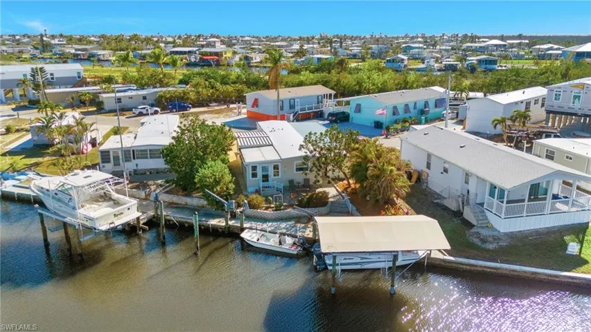 Aerial rear view featuring a water view