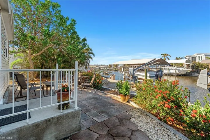 View of patio / terrace leading to the canal