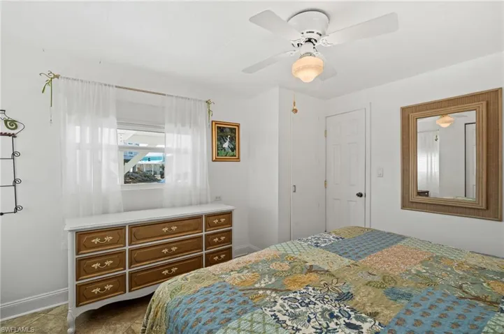 Master bedroom with coastal dresser and decor