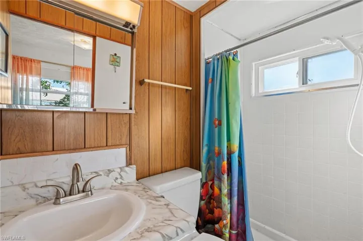 Guest bathroom with a tub and shower