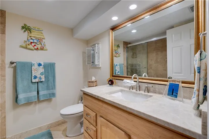 Guest Bathroom with vanity, a shower stall, and recessed lighting