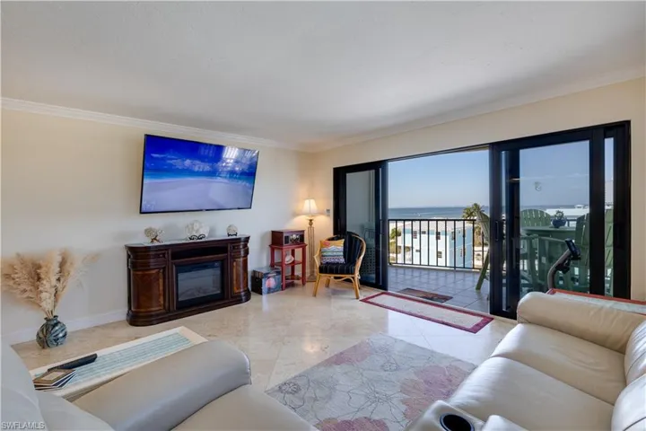 Living area featuring a glass covered fireplace