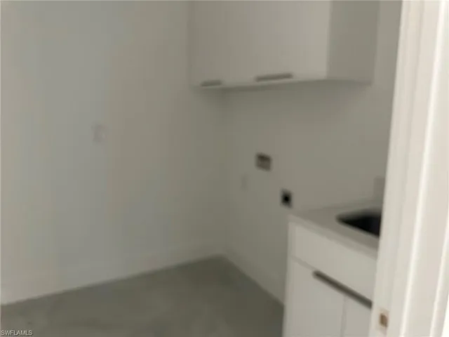 Laundry room featuring electric dryer hookup