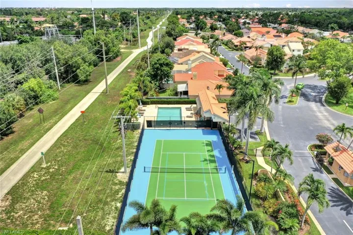 Aerial view of the community pool and tennis courts.