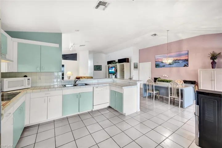 Kitchen features the open floor plan with plenty of space to entertain.