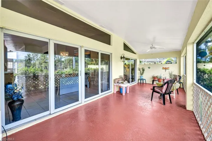 Spacious Lanai with hurricane impact sliding glass doors that open to the great room living and kitchen. Enjoy the quietness of the fountain and lake view.