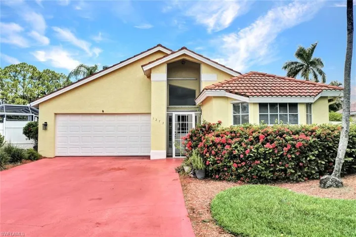 View of front of home featuring a garage.