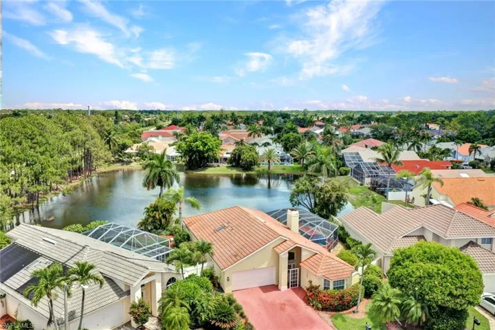 Only 3.7 Miles to 5th Avenue. Aerial view of home and gorgeous fountain and lake view