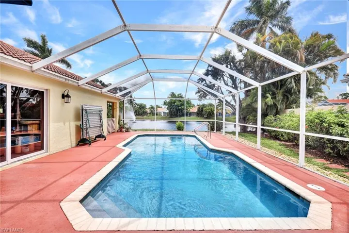 View of swimming pool with a VIEW, the lanai extends the length of the home in the back. Wrap around lanai with covered living space.