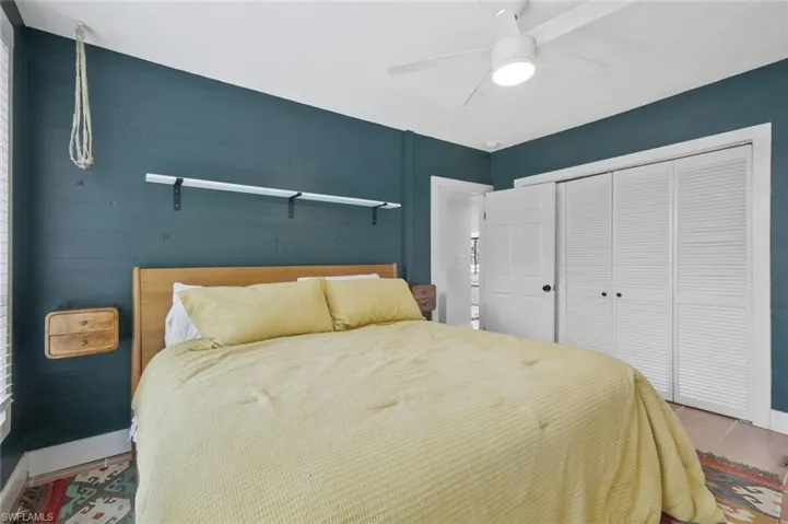 Bedroom featuring a closet and ceiling fan