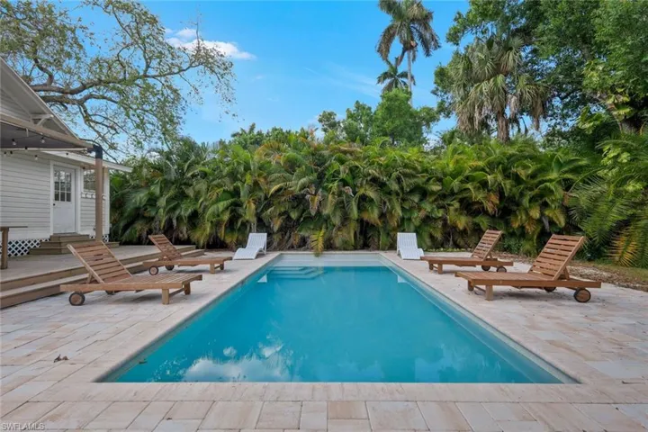 Swimming pool featuring a patio and a deck
