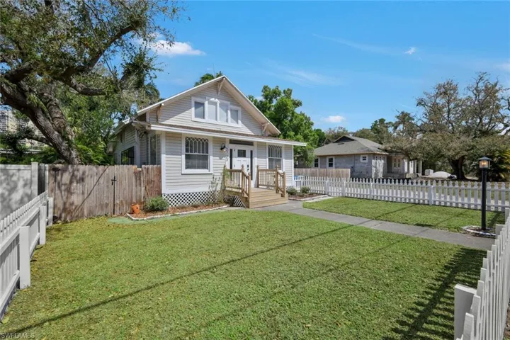 Bungalow-style home featuring a gate