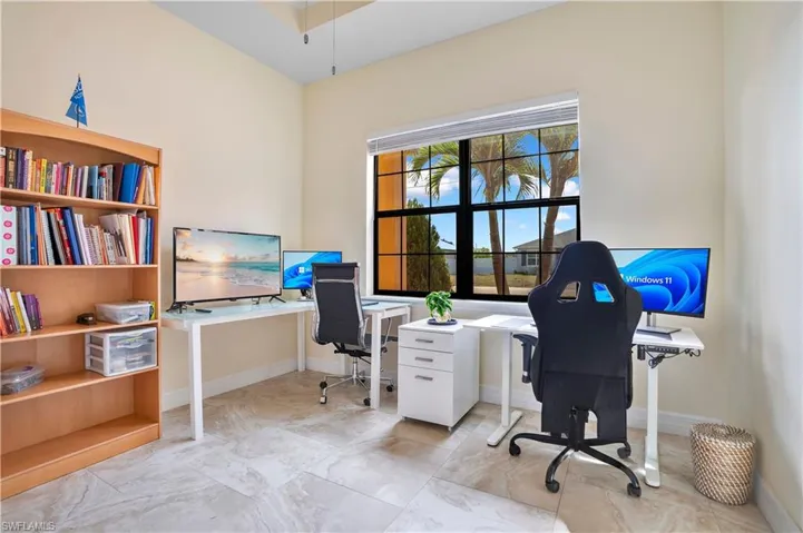 Office area featuring baseboards