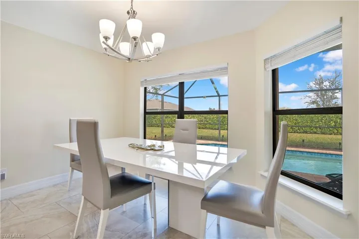 Dining area featuring baseboards and suspended lighting