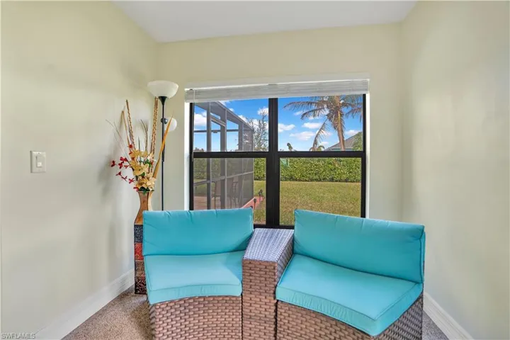 Sitting room featuring carpet floors and baseboards