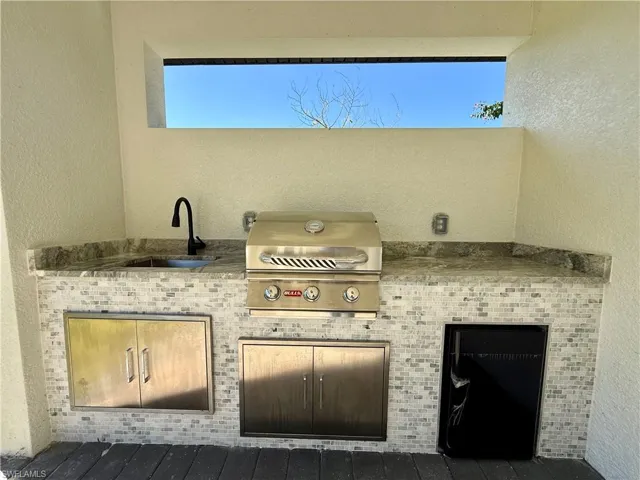 View of patio featuring area for grilling