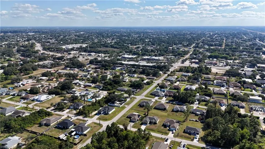 View of property location with nearby suburban area