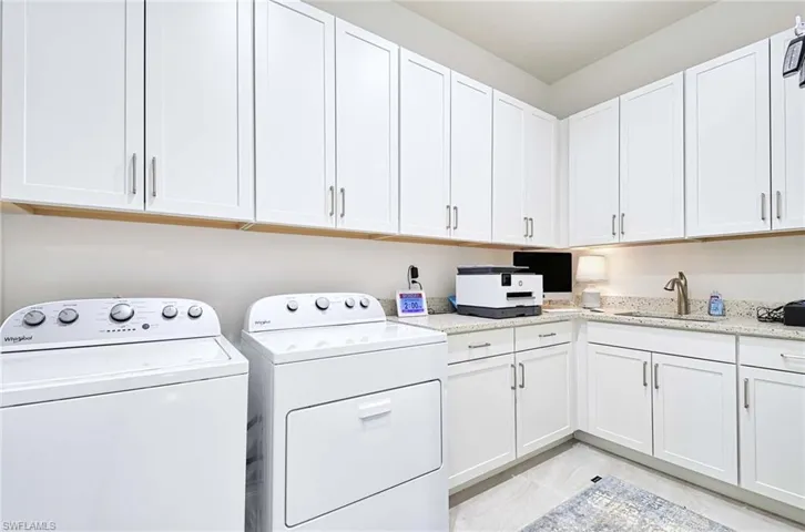 Spacious Laundry Room, plenty of storage cabinets