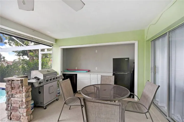View of grill area and outside refrigerators to store all your favorite beverages.