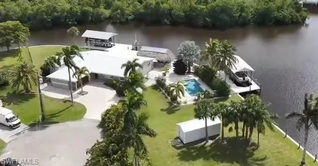 .62 ACRE GULF ACCESS – 175 FT SEAWALL – 2 BOAT LIFTS