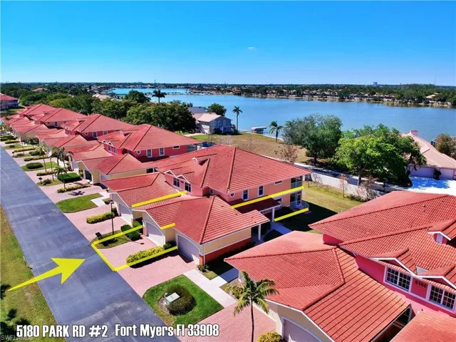Birds eye view of property featuring a residential view and a water view