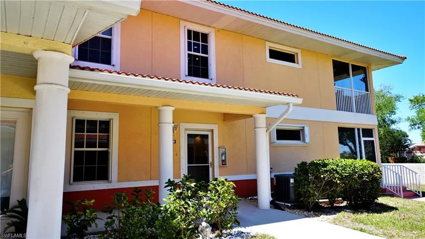 View of front of home featuring stucco siding and central AC unit