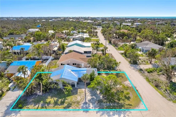 Aerial view of residential area with property boundaries highlighted