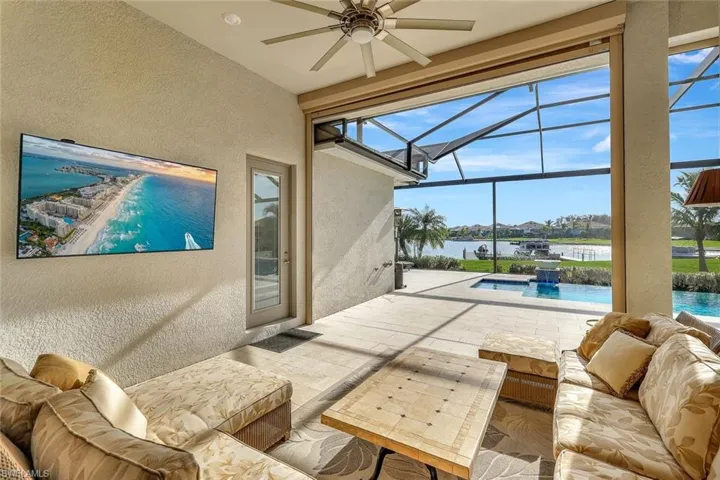 View of patio with pool water feature, a water view, and an outdoor hangout area