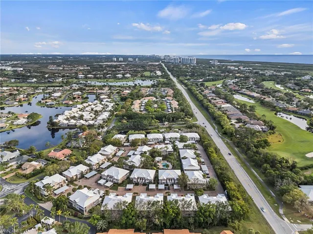 Gulf of Mexico and Community. Facing South. Vanderbilt Drive to the right of the commmunity