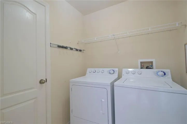 Washroom featuring washer and dryer