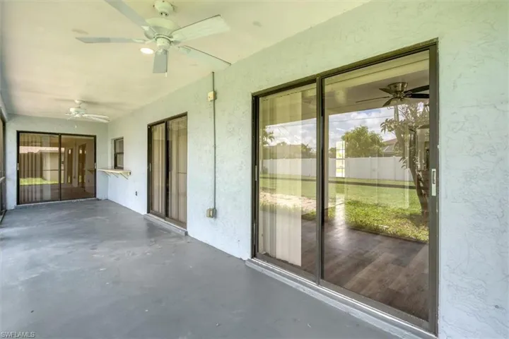 View of patio featuring ceiling fan