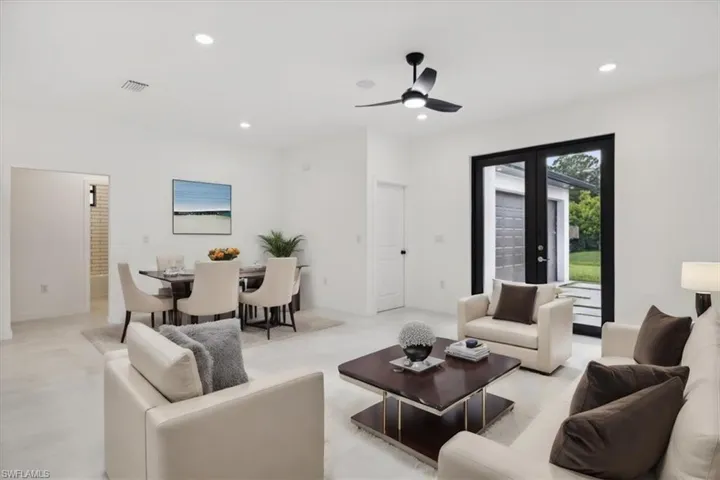 virtually staged-Living area featuring recessed lighting, ceiling fan, and french doors