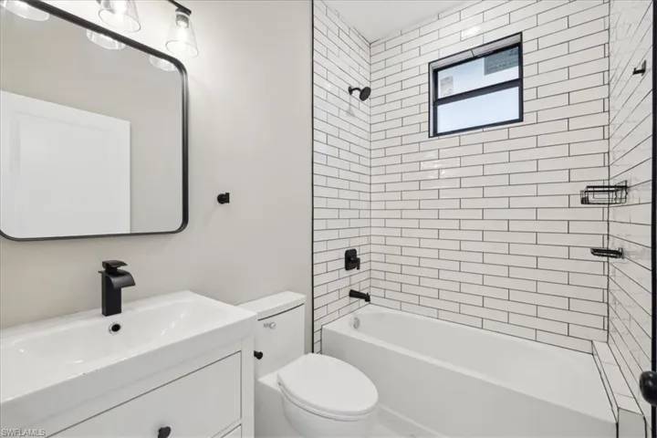 Bathroom featuring vanity and shower / tub combination