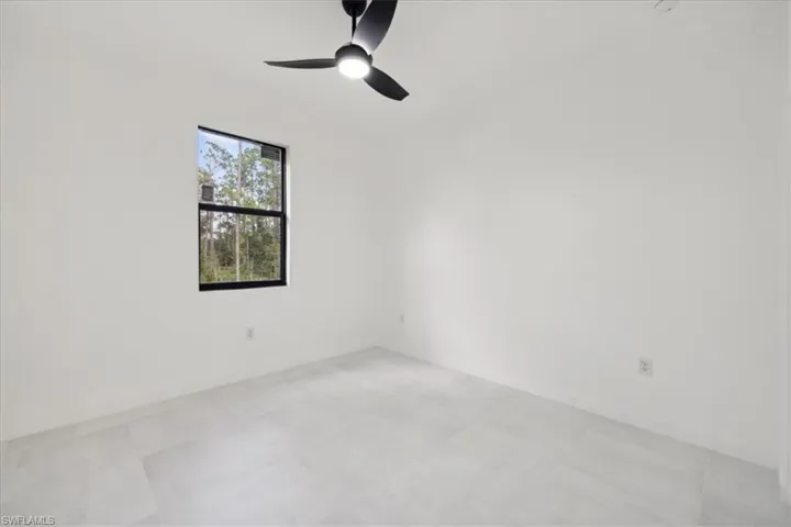 Spare room featuring a ceiling fan